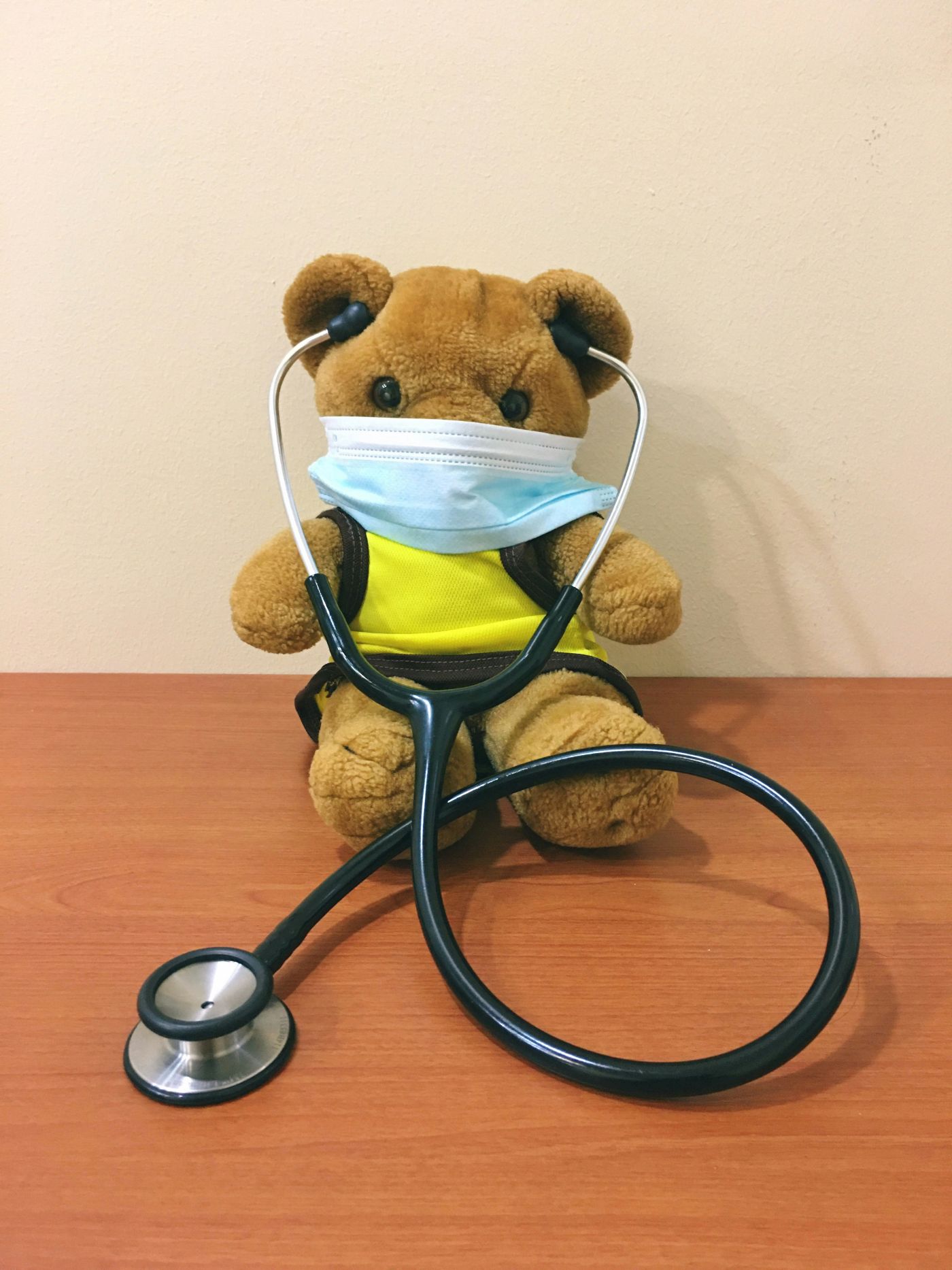 Stuffed bear doctor with a mask and stethoscope, representing warm, concierge-style pediatric care that puts families first and makes healthcare simple